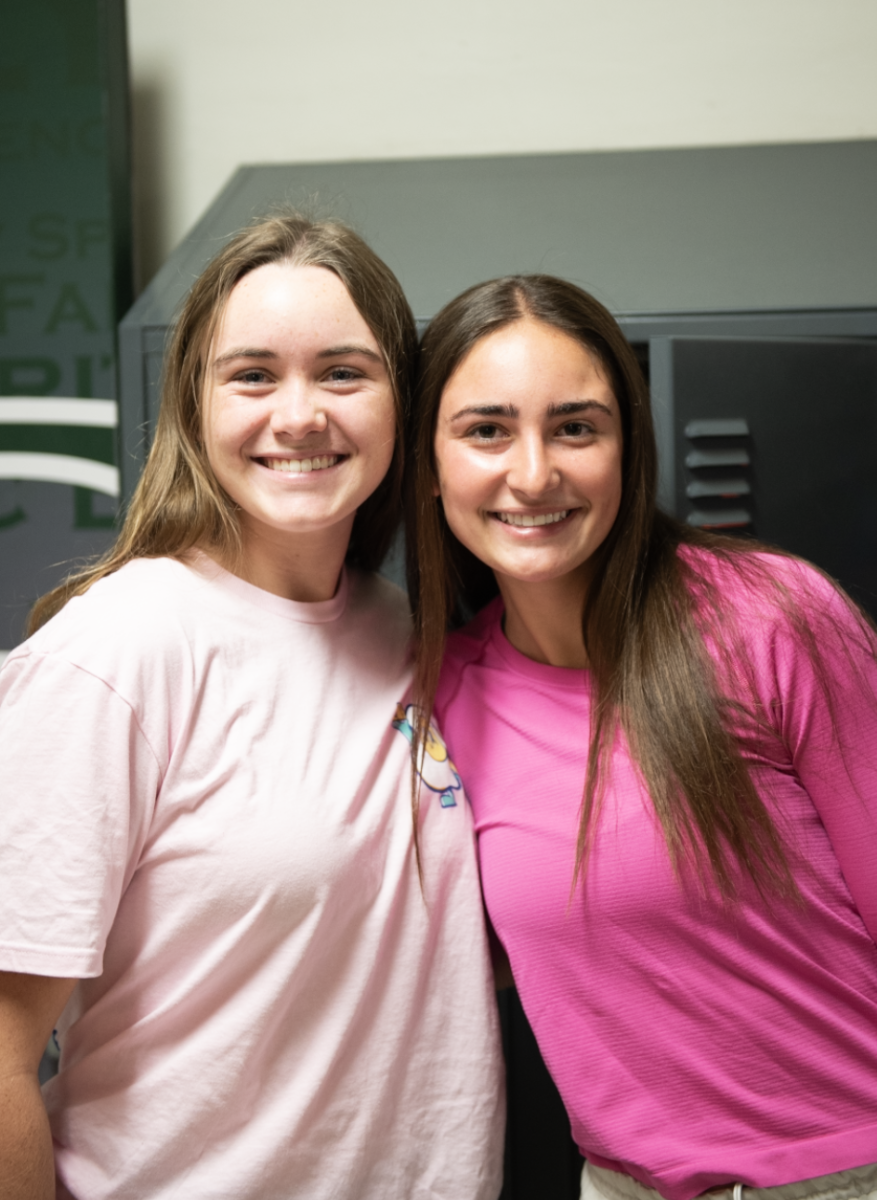 10.24.24 (From L to R) Seniors Madgie Prill and Anna Prill standing in senior hallway on Pink Day. 